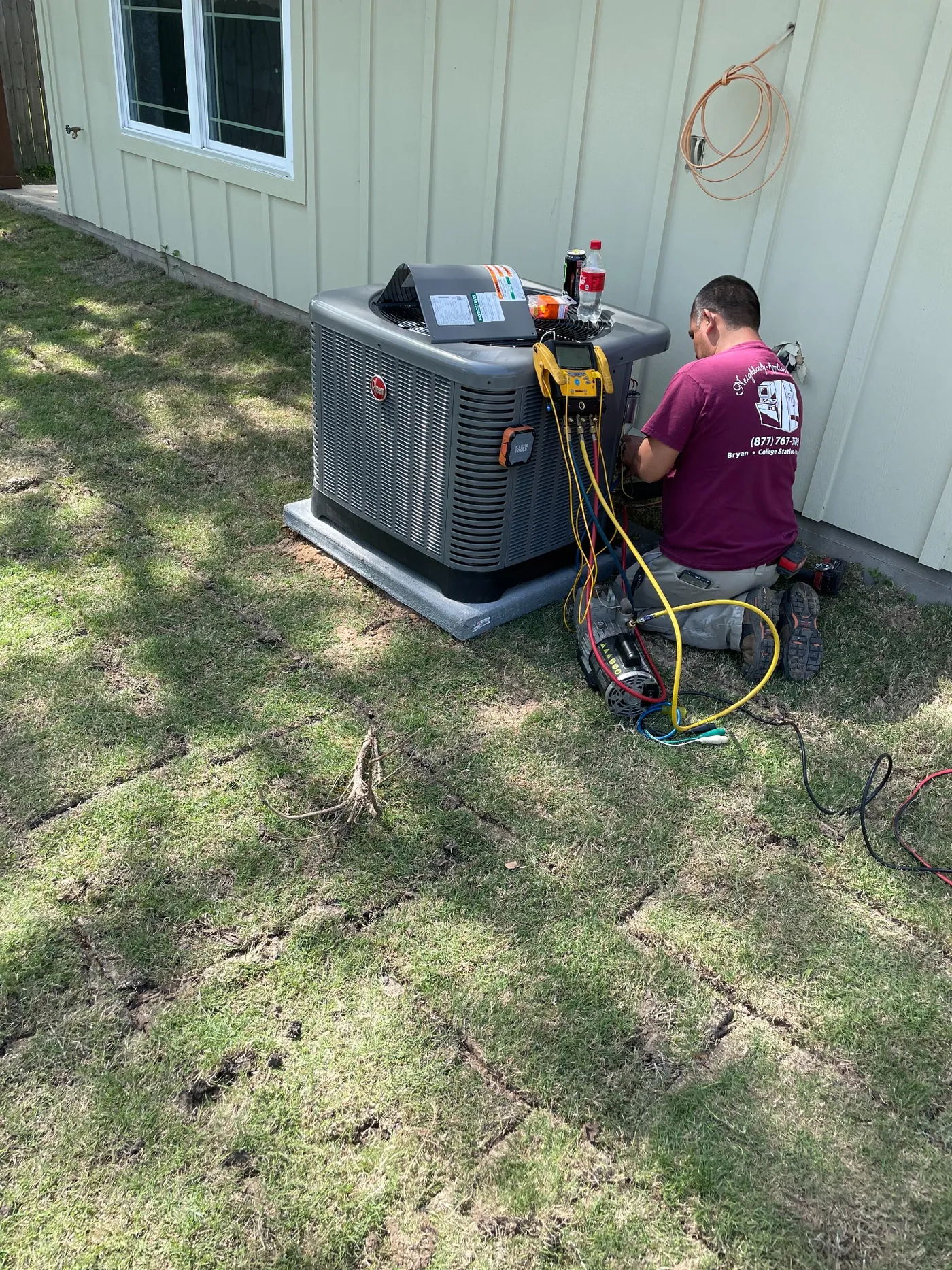 Technician performing AC diagnostics