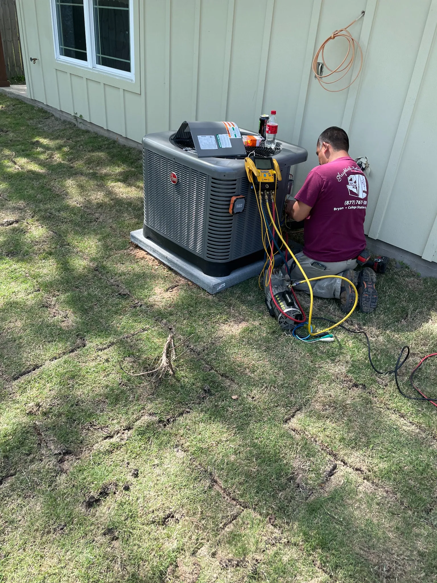 Neighborly HVAC technician diagnosing an outdoor air conditioner