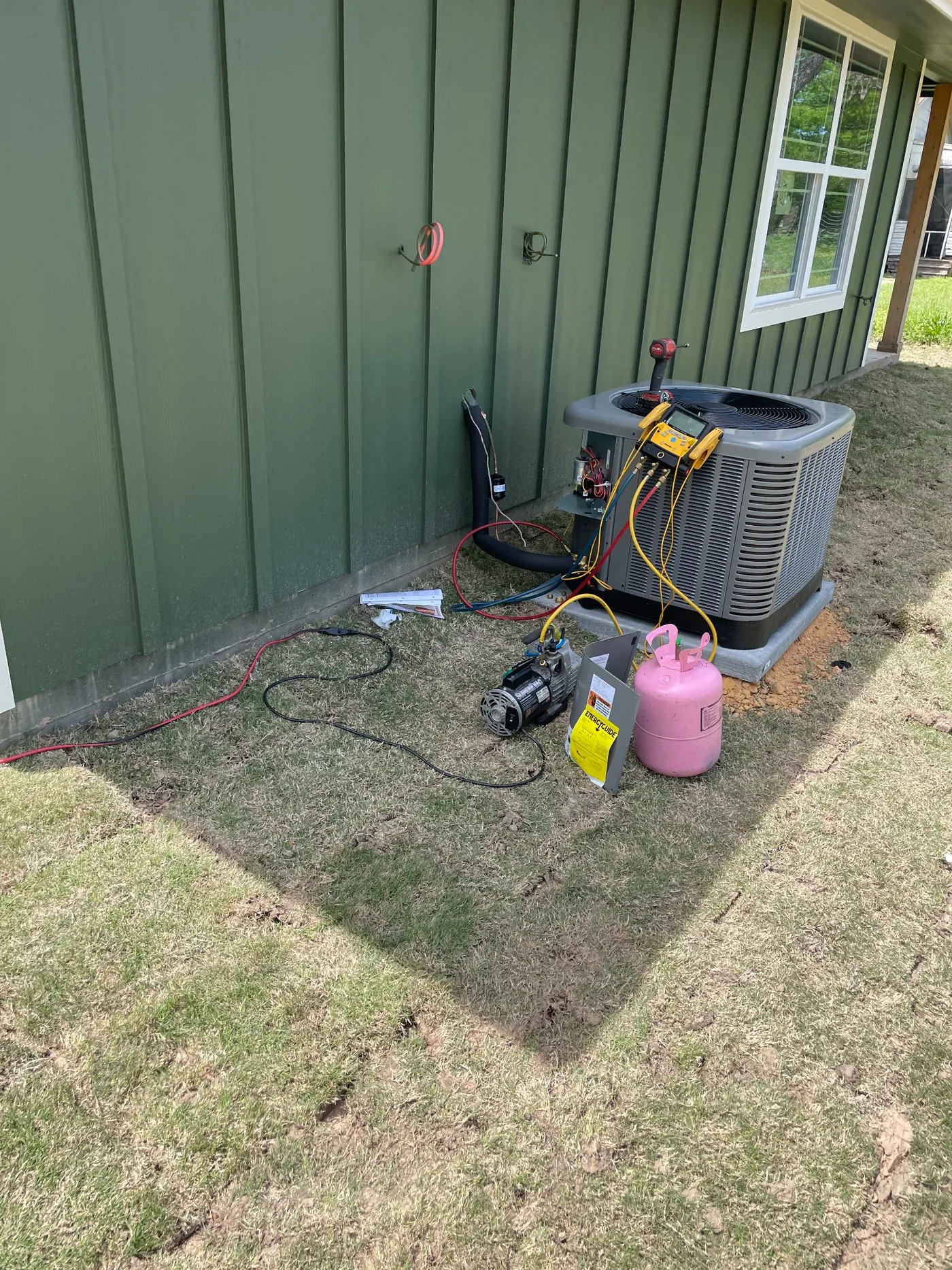 AC system being serviced with diagnostic equipment